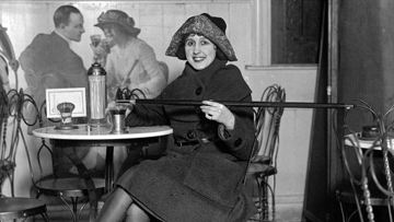 a woman in 1922 uses a “cane tipping flask